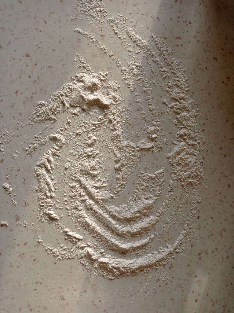 Floured work surface prepared for kneading bread dough