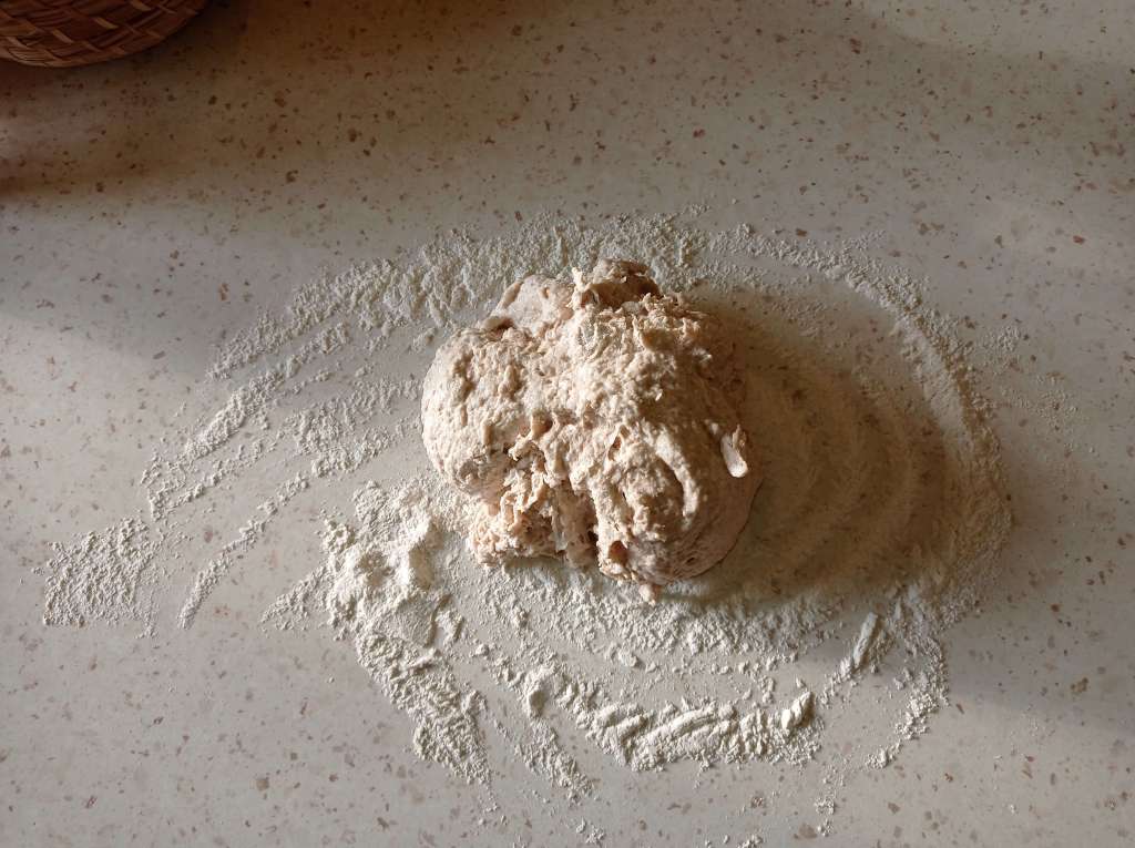 Bread dough turned onto floured work surface for shaping